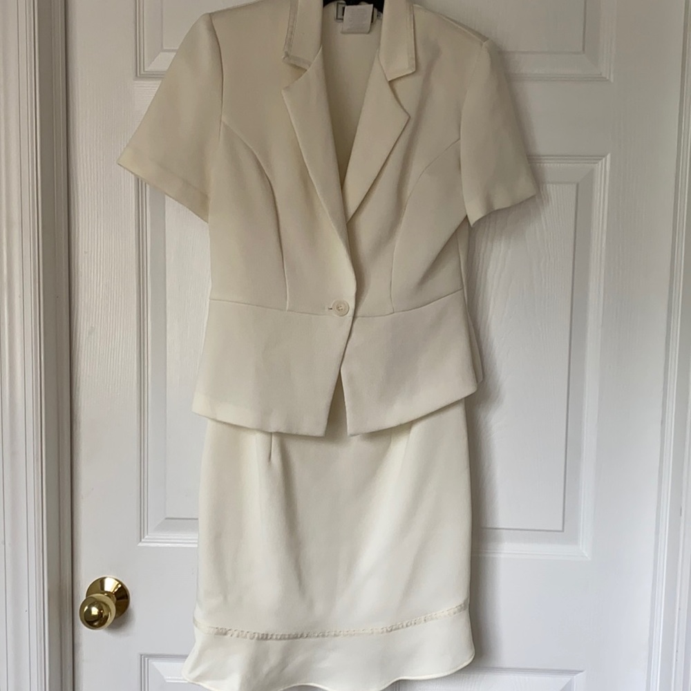 Sleeveless dress with short sleeve jacket.